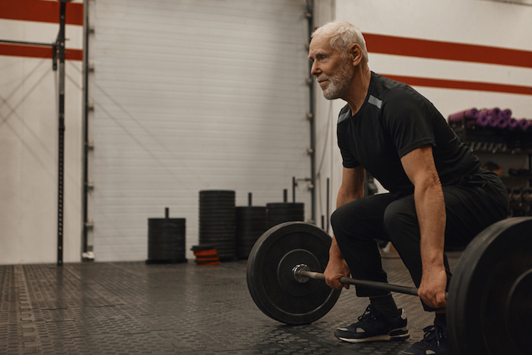 older guy with barbell